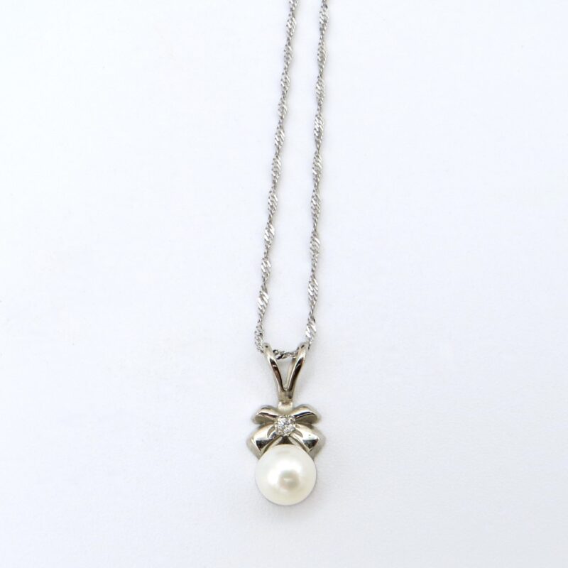 White Gold & Pearl Bow Necklace