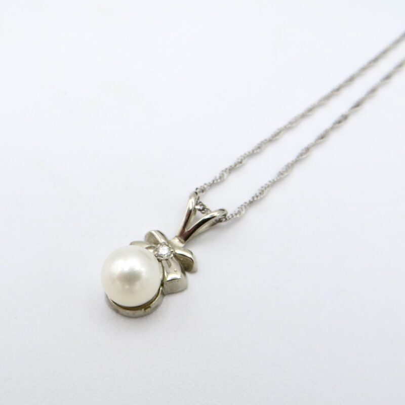 White Gold & Pearl Bow Necklace